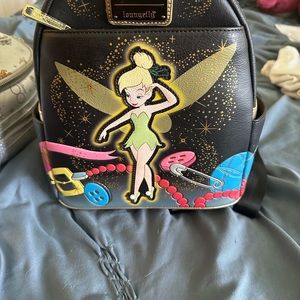 Tinkerbell loungefly that lights up. Only used twice